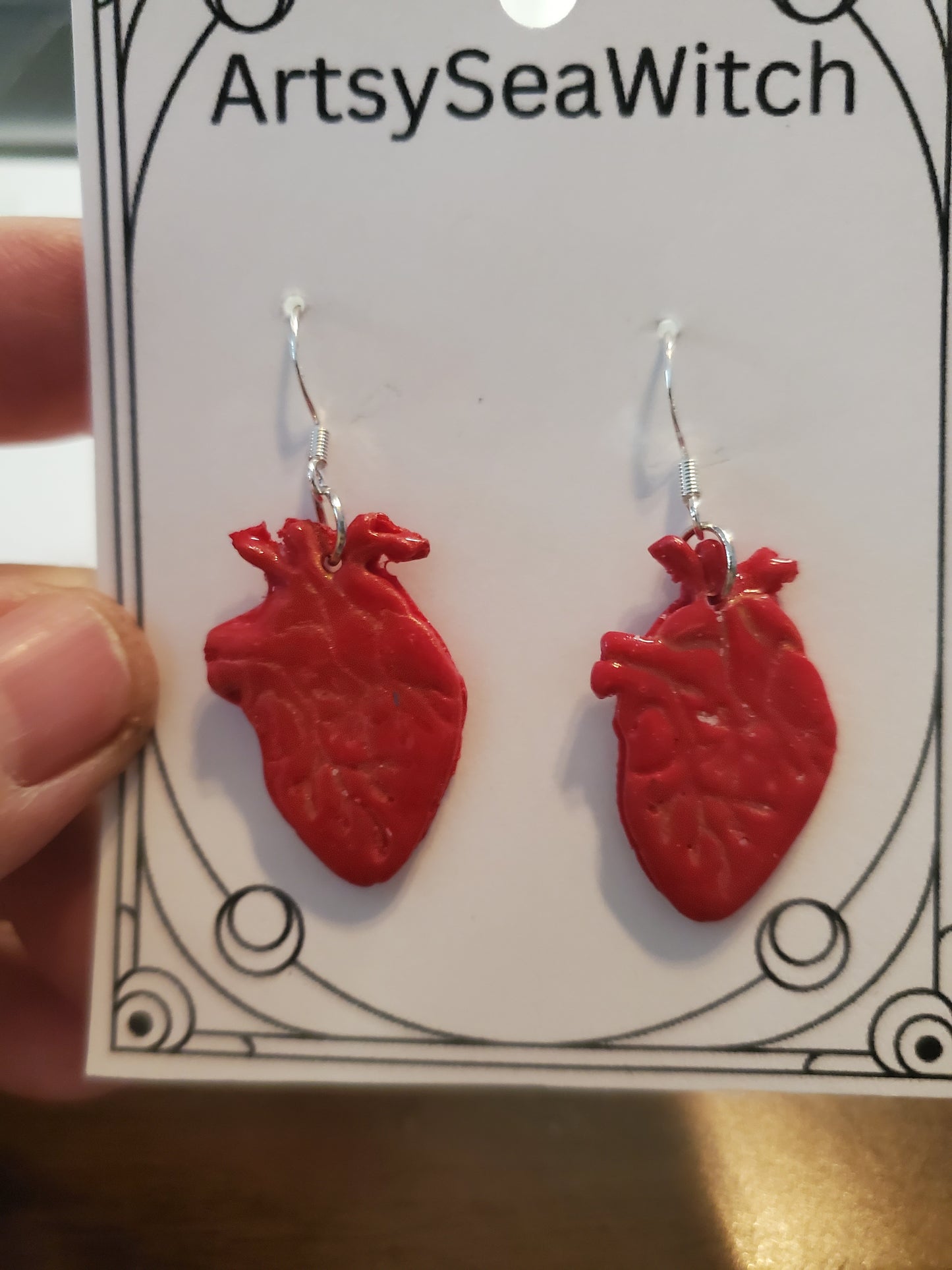Human heart earrings